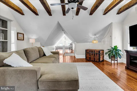 a bedroom with a bed window and a table