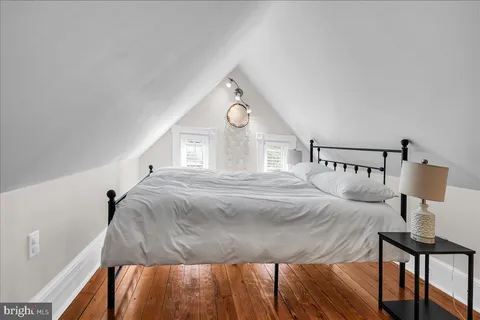 a view of a patio with table and chairs potted plants