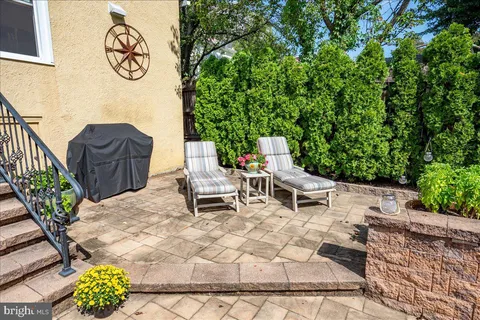 an aerial view of multiple houses with yard
