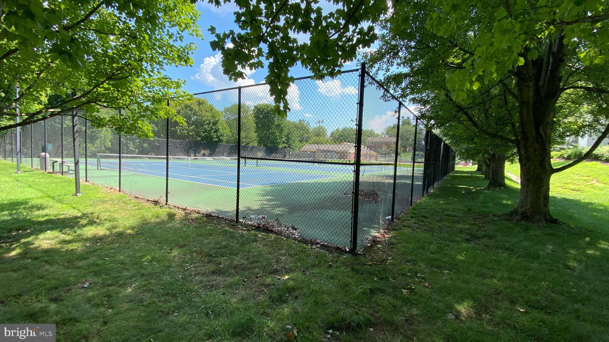 5766 Rexford Court, Unit Q Springfield, VA 22152 - Photo 25 of 29 FENCED TENNIS COURT IN THE WOODEN AREA
