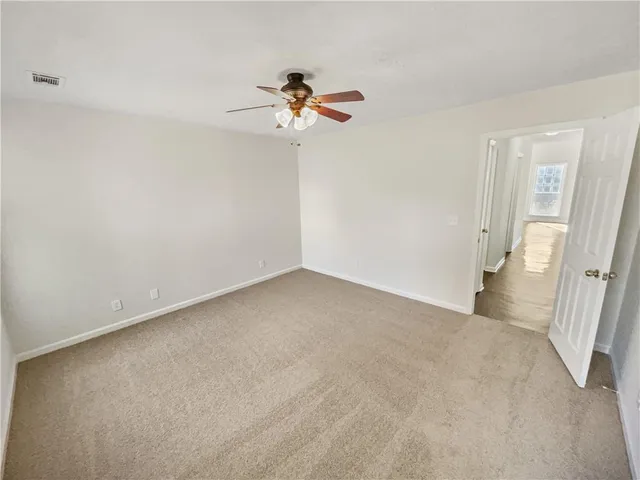 a backyard of a house with lots of green space