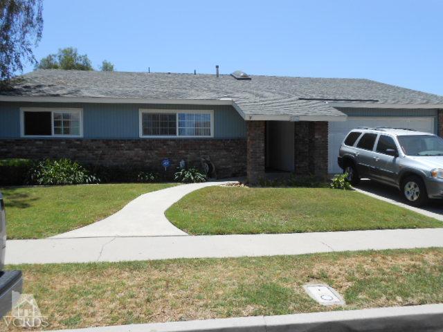 2450 Fitzgerald Road Simi Valley, CA 93065 - Photo 1 of 14 a front view of a house with a yard and garage