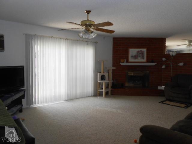2450 Fitzgerald Road Simi Valley, CA 93065 - Photo 4 of 14 a view of livingroom with furniture and chandelier fan