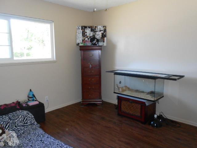 2450 Fitzgerald Road Simi Valley, CA 93065 - Photo 10 of 14 a bed sitting in a bedroom next to a window