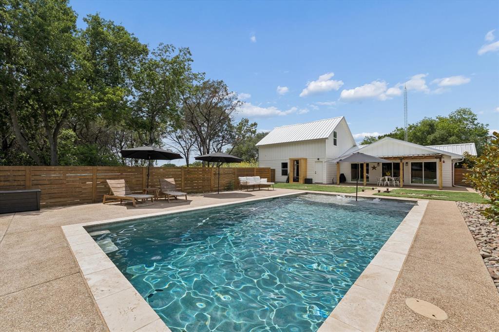 286 Benevolence Way China Spring, TX 76633 - Photo 27 of 37 Custom-shaped swimming pool with stone coping and an expansive concrete surround