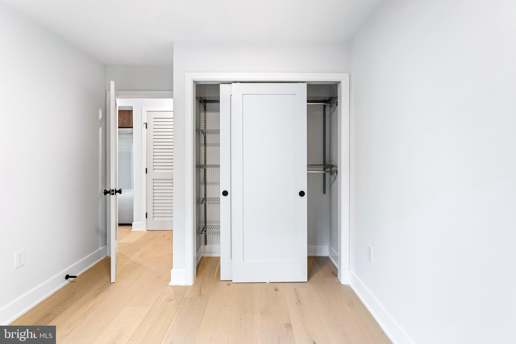 845 19th Street Northeast, Unit 4 Washington, DC 20002 - Photo 8 of 14 a view of a hallway with wooden floor and closet