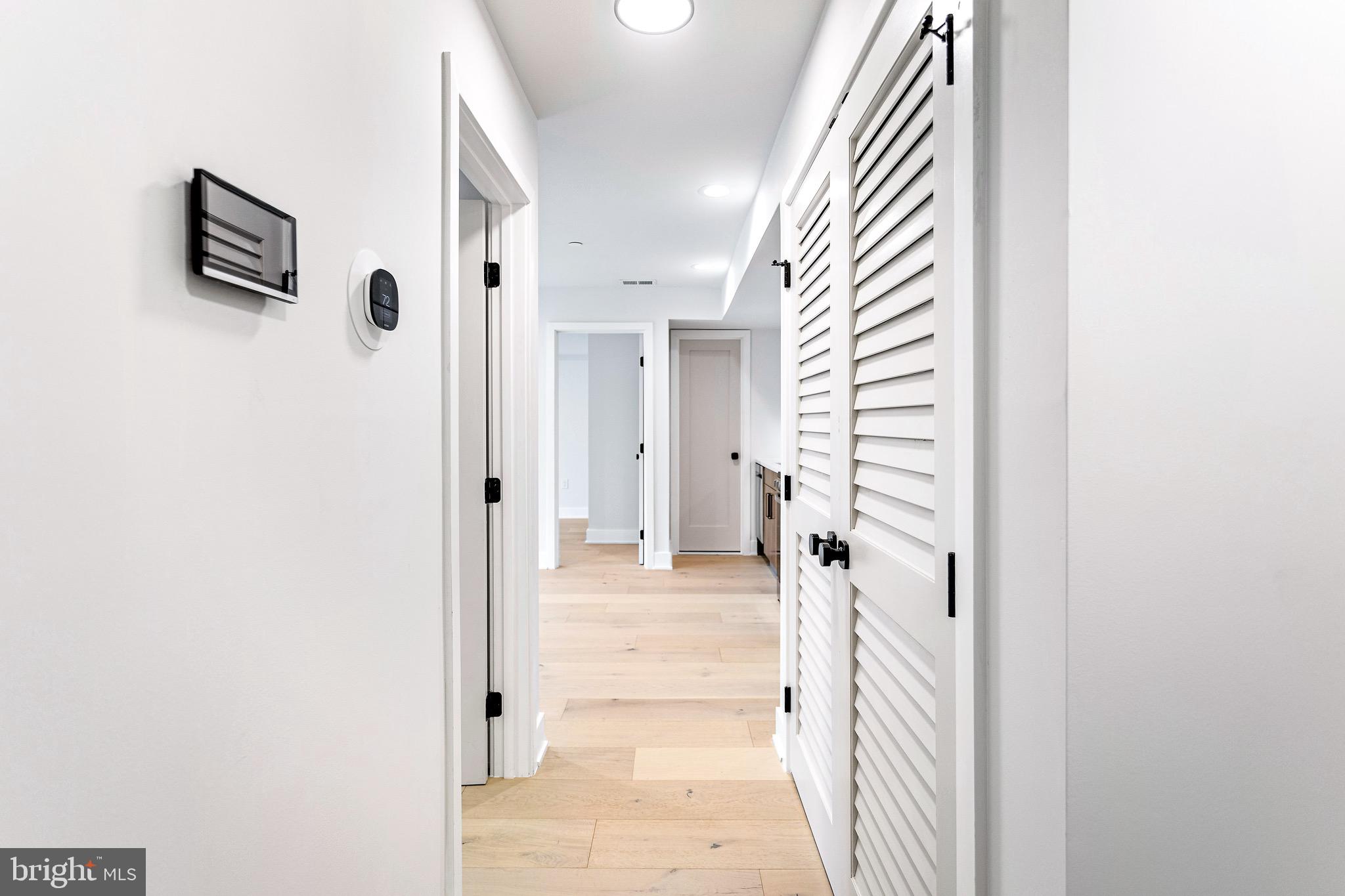 845 19th Street Northeast, Unit 4 Washington, DC 20002 - Photo 10 of 14 a view of a hallway with wooden floor and entryway