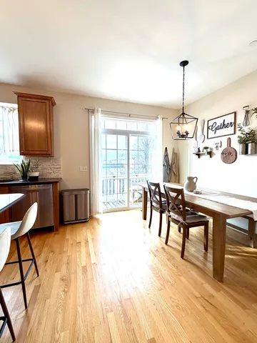 a view of a dining room with furniture window and wooden floor