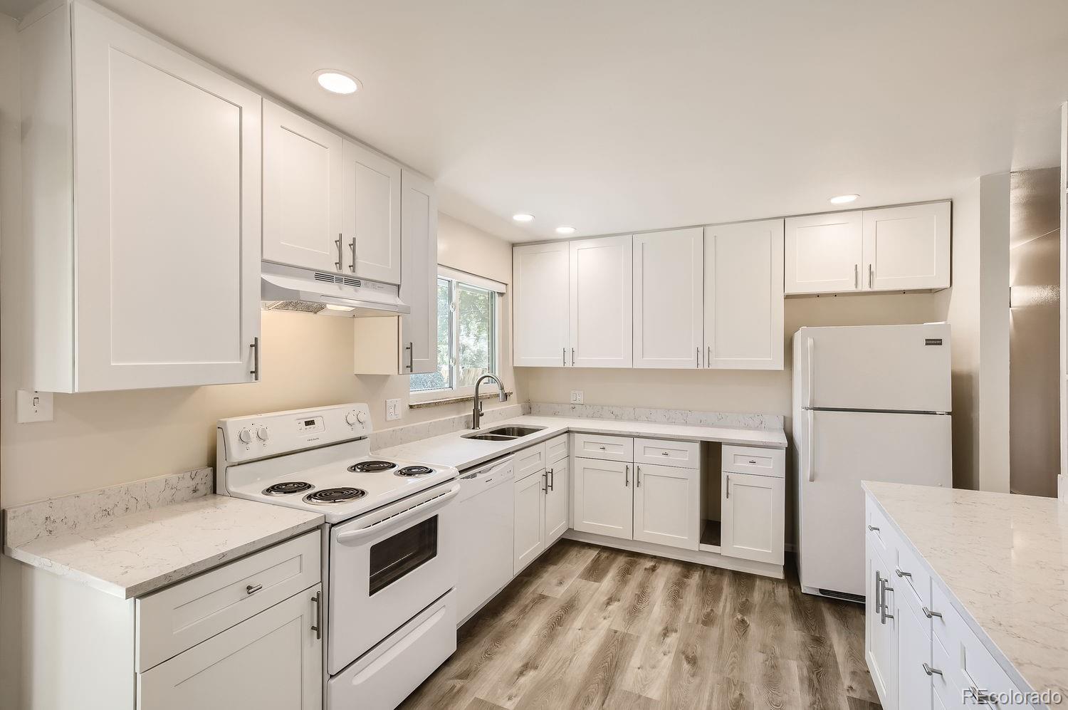 3205 Moorhead Avenue Boulder, CO 80305 - Photo 6 of 11 a kitchen with a stove a sink and a refrigerator