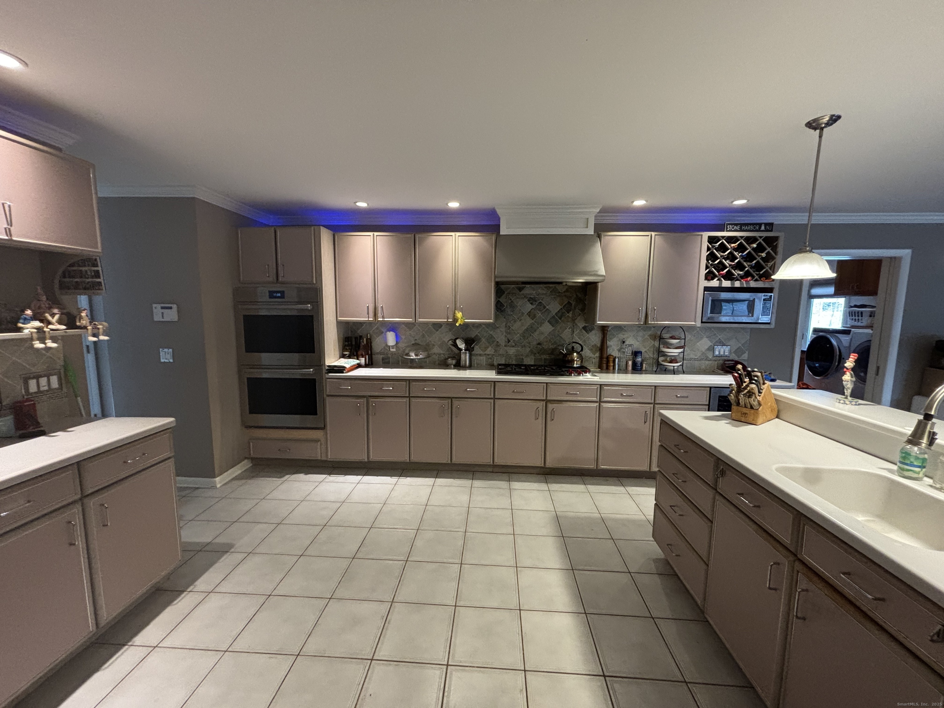 33 Walnut Tree Hill Road Shelton, CT 06484 - Photo 6 of 27 a kitchen with a sink a counter top space cabinets and stainless steel appliances
