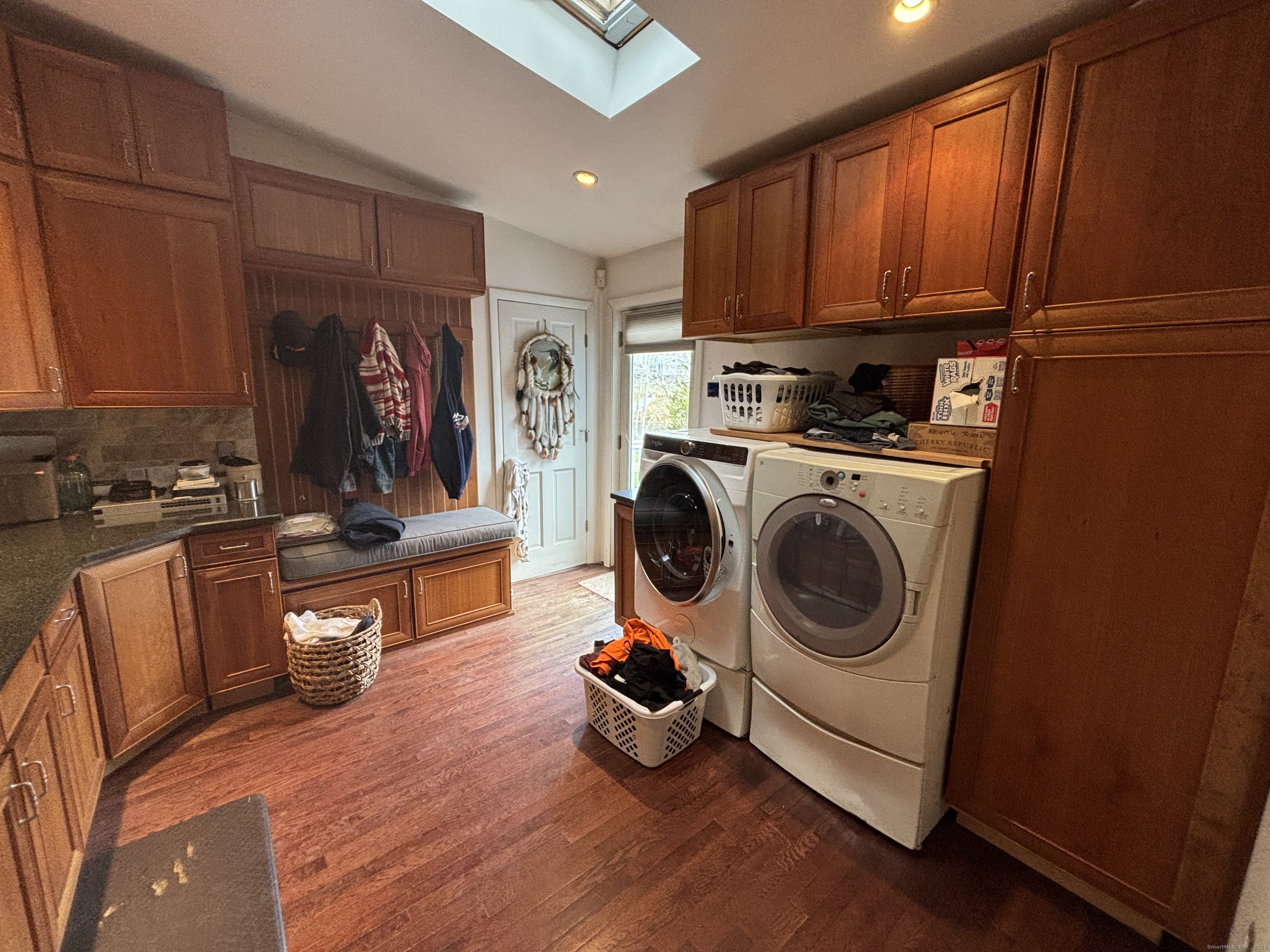 33 Walnut Tree Hill Road Shelton, CT 06484 - Photo 8 of 27 a living room with furniture a flat screen tv and a refrigerator