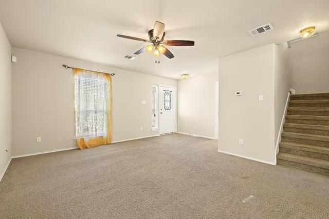 a view of an empty room with a window