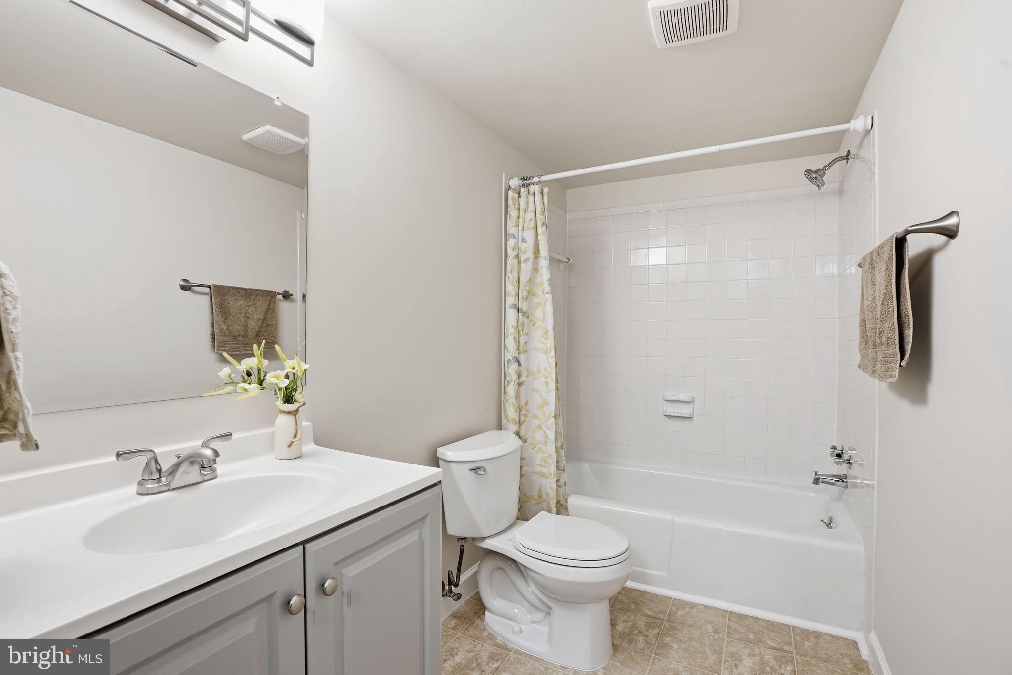 1552 Northgate Square, Unit 12B Reston, VA 20190 - Photo 12 of 23 a bathroom with a sink toilet and shower
