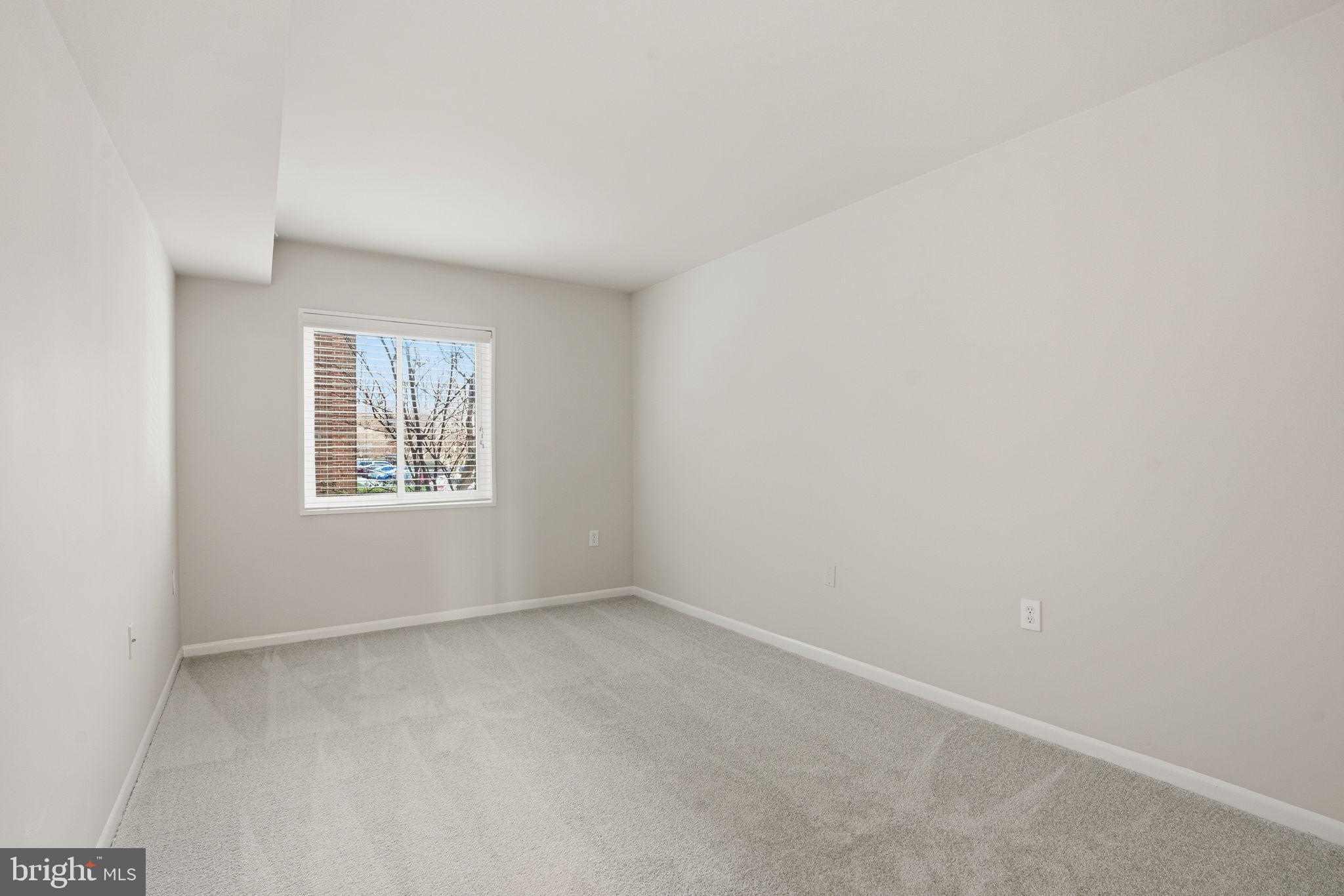 1552 Northgate Square, Unit 12B Reston, VA 20190 - Photo 13 of 23 an empty room with windows
