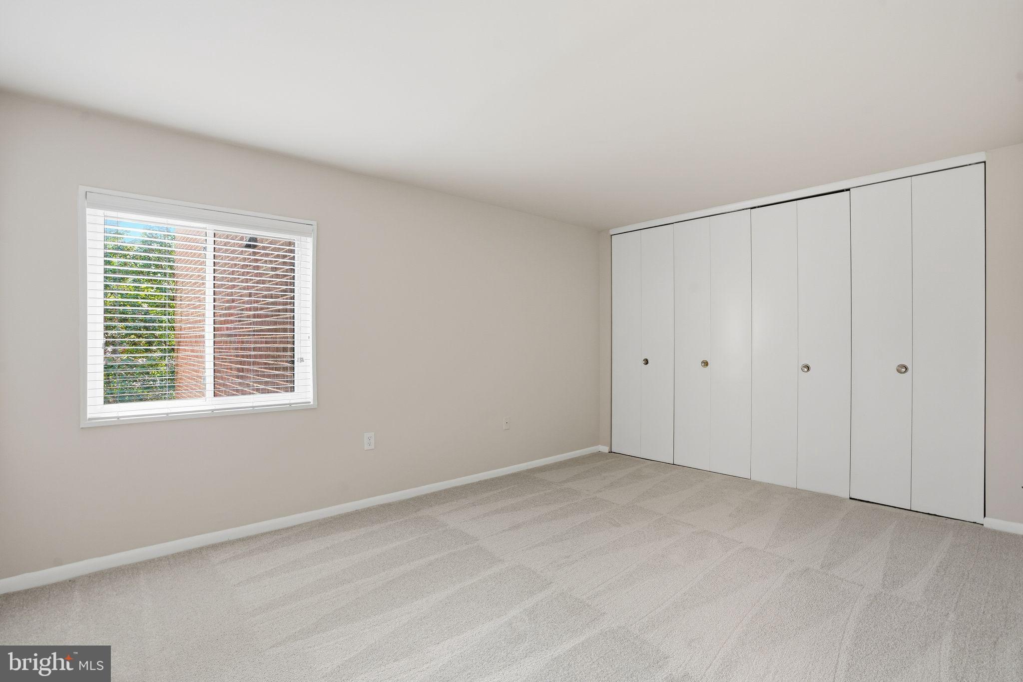 1552 Northgate Square, Unit 12B Reston, VA 20190 - Photo 16 of 23 a view of an empty room with a window