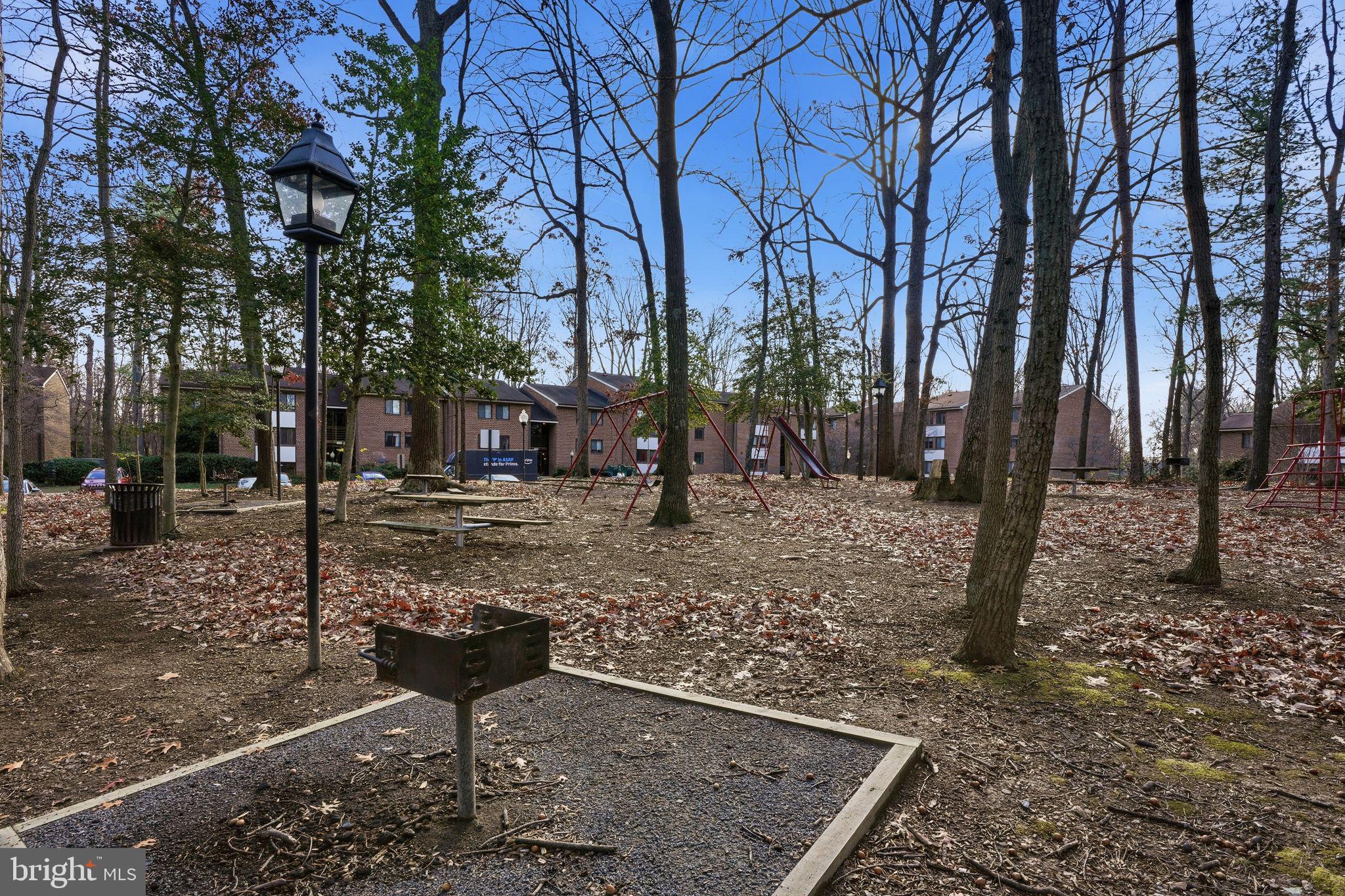 1552 Northgate Square, Unit 12B Reston, VA 20190 - Photo 21 of 23 a view of a backyard with large trees