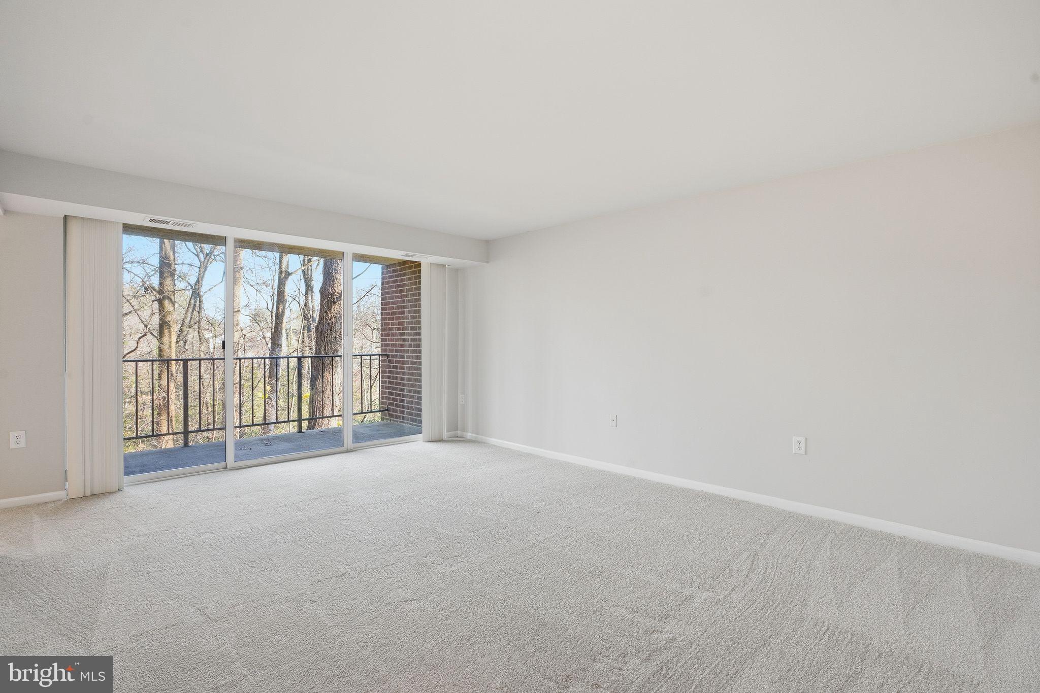 1552 Northgate Square, Unit 12B Reston, VA 20190 - Photo 7 of 23 a view of an empty room with a balcony