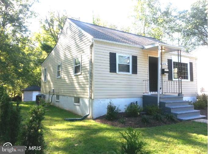 12418 Dewey Road Rockville, MD 20853 - Photo 1 of 20 a view of backyard with a garden and plants