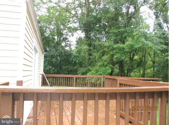12418 Dewey Road Rockville, MD 20853 - Photo 2 of 20 a view of a wooden fence and trees
