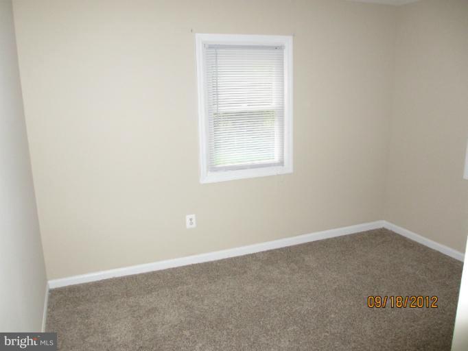 12418 Dewey Road Rockville, MD 20853 - Photo 12 of 20 an empty room with a window