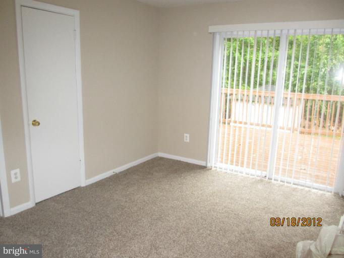 12418 Dewey Road Rockville, MD 20853 - Photo 14 of 20 a view of an empty room with a window