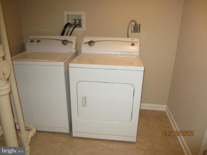 12418 Dewey Road Rockville, MD 20853 - Photo 16 of 20 a utility room with dryer and washer