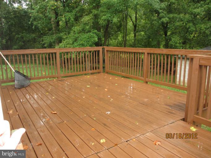 12418 Dewey Road Rockville, MD 20853 - Photo 4 of 20 a view of balcony with wooden floor