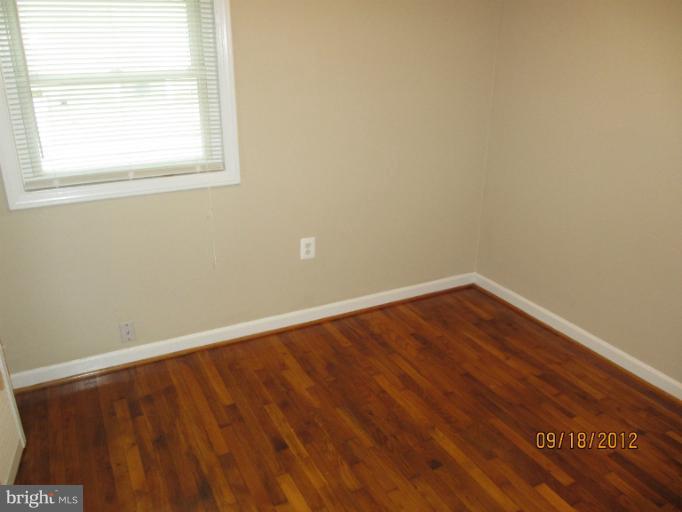 12418 Dewey Road Rockville, MD 20853 - Photo 7 of 20 an empty room with a window