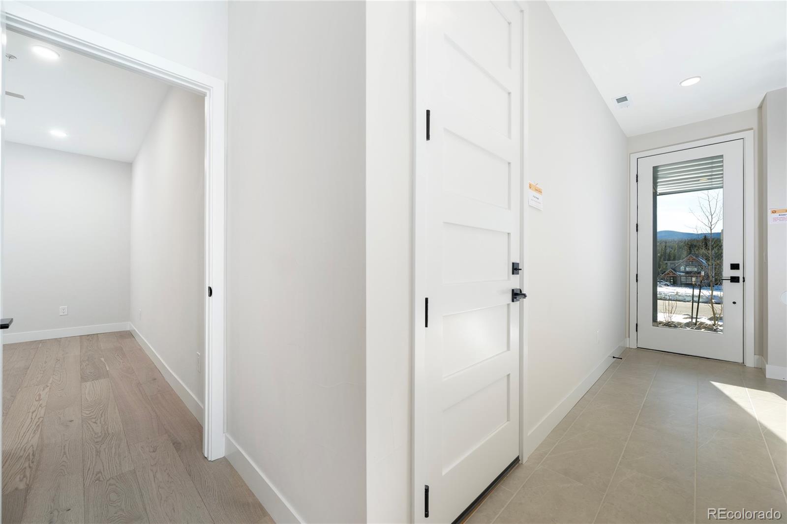 38 Wheeler Road Winter Park, CO 80482 - Photo 3 of 45 a view of a hallway with wooden floor and windows
