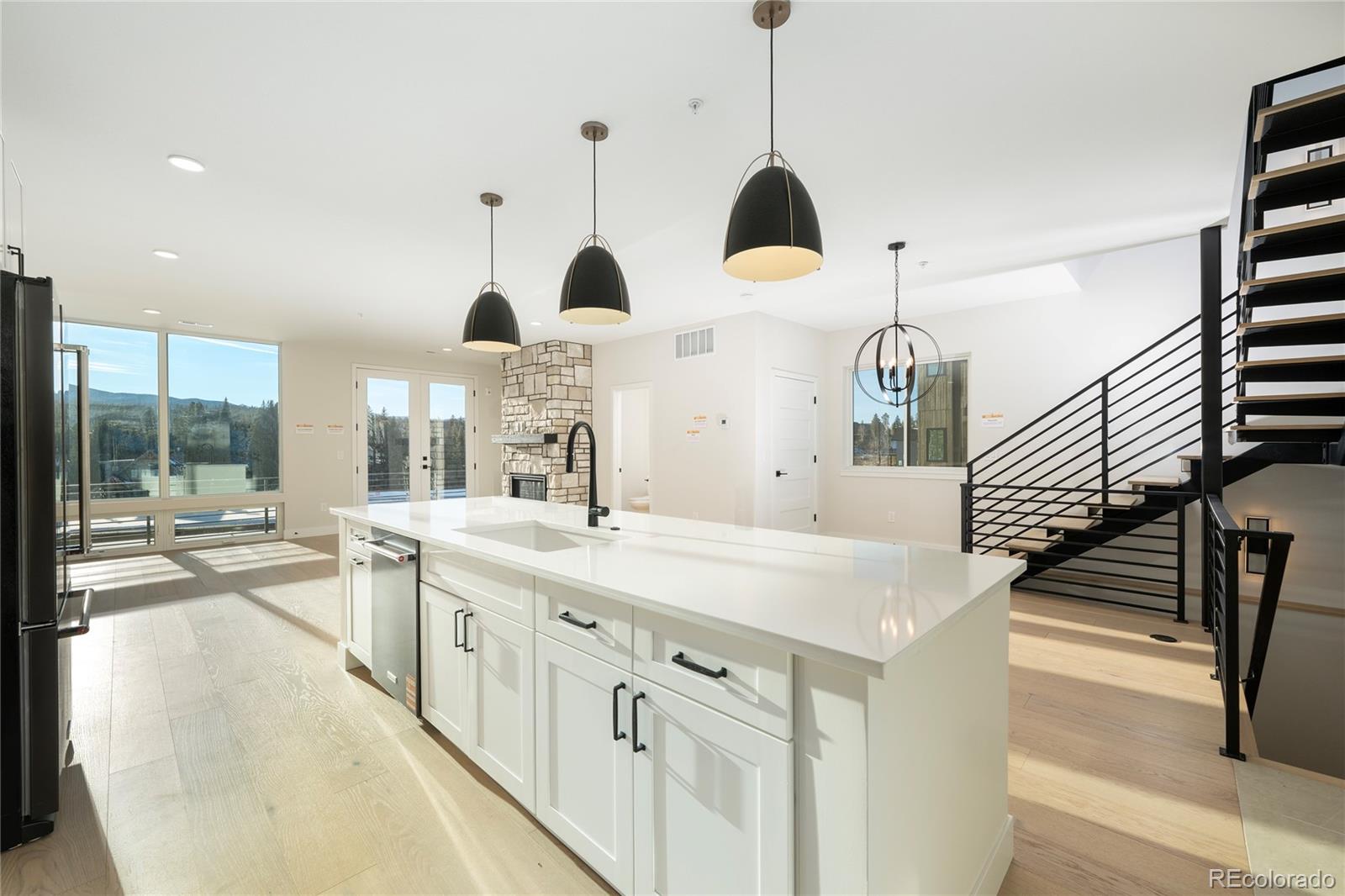 38 Wheeler Road Winter Park, CO 80482 - Photo 32 of 45 a kitchen with kitchen island a sink counter top space and a stove