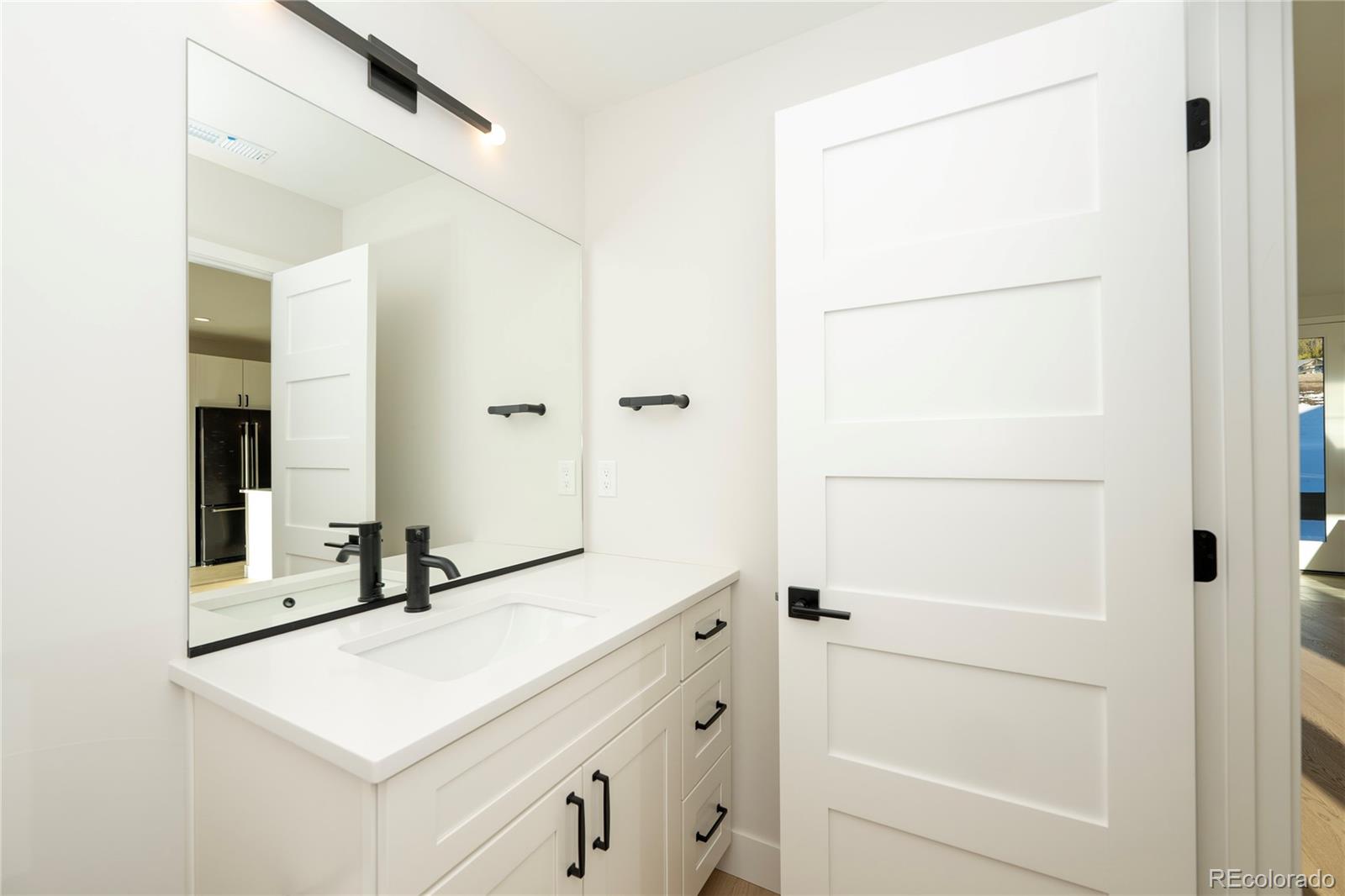38 Wheeler Road Winter Park, CO 80482 - Photo 33 of 45 a bathroom with a sink and a mirror