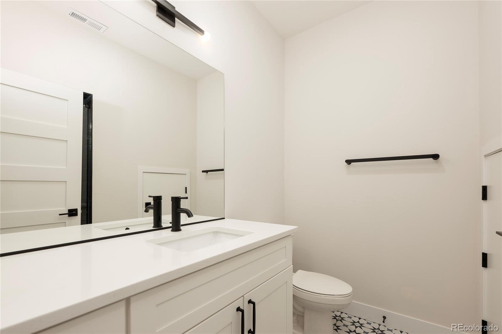 38 Wheeler Road Winter Park, CO 80482 - Photo 8 of 45 a bathroom with a sink and a toilet