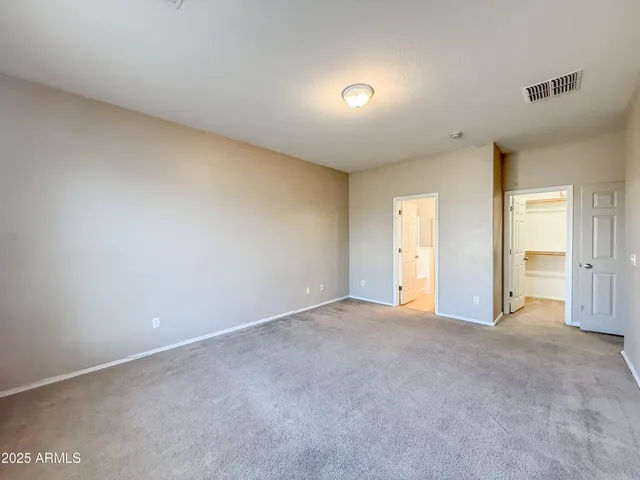 a bathroom with a double vanity sink mirror and toilet