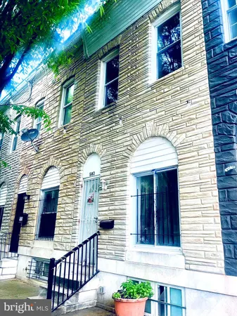 a view of a brick house with brick walls