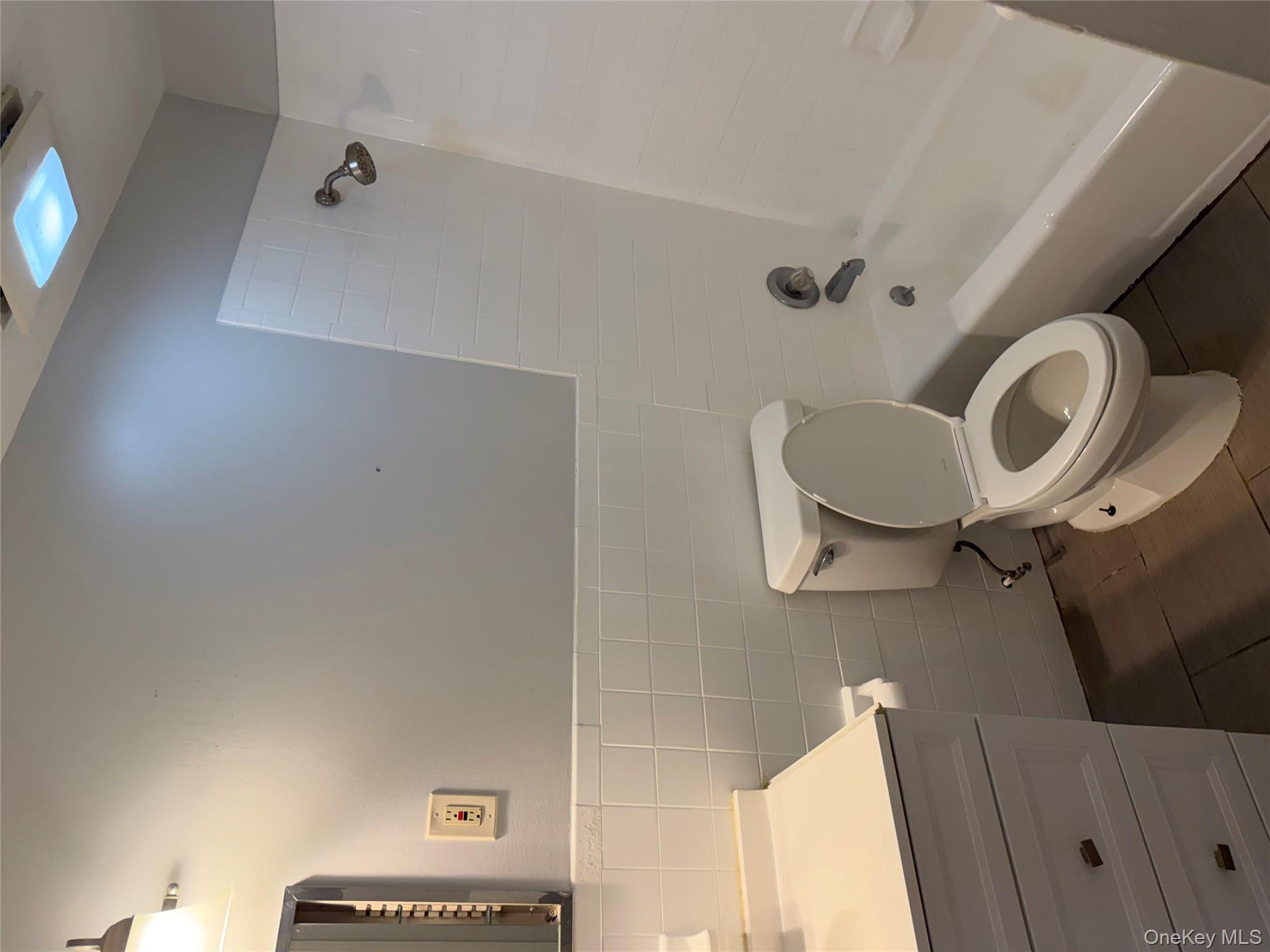 35 Prairie Avenue, Unit B Suffern, NY 10901 - Photo 11 of 11 a bathroom with a sink a toilet and bathtub