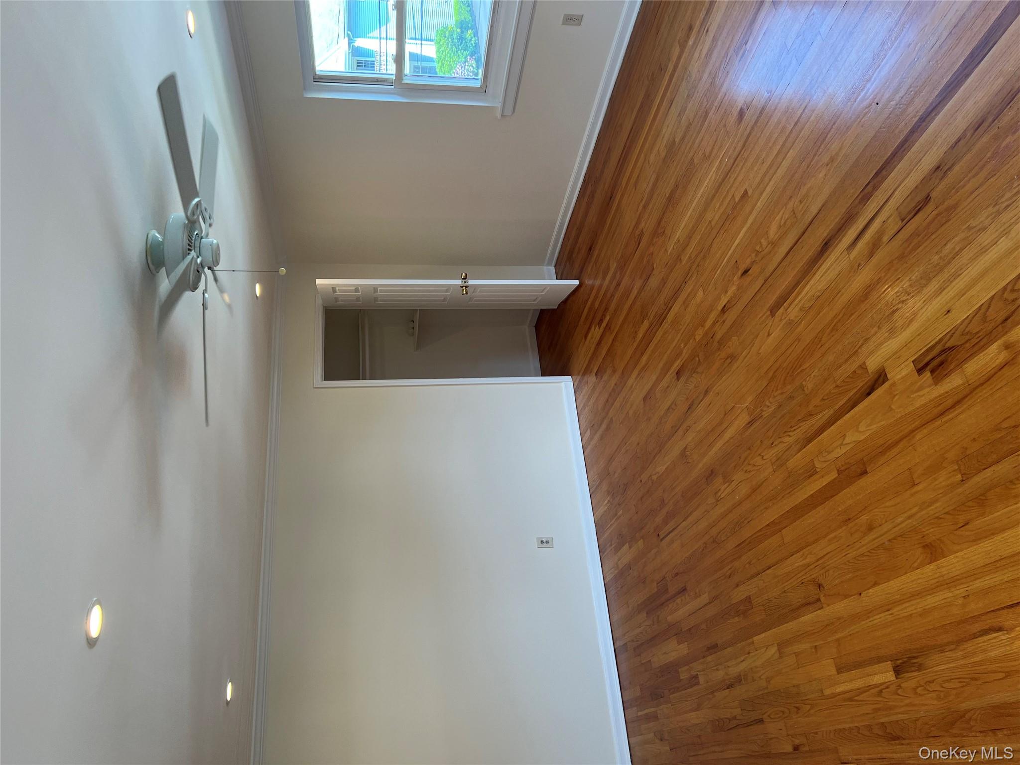 35 Prairie Avenue, Unit B Suffern, NY 10901 - Photo 9 of 11 an empty room with wooden floor and windows