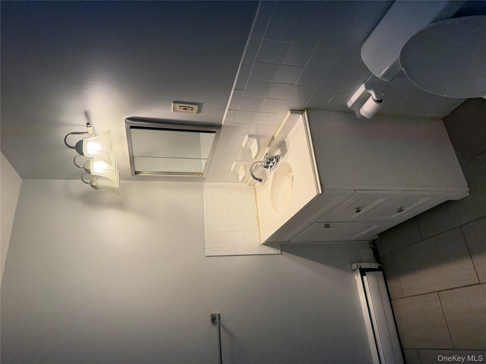 35 Prairie Avenue, Unit B Suffern, NY 10901 - Photo 10 of 11 a bathroom with a sink vanity and mirror