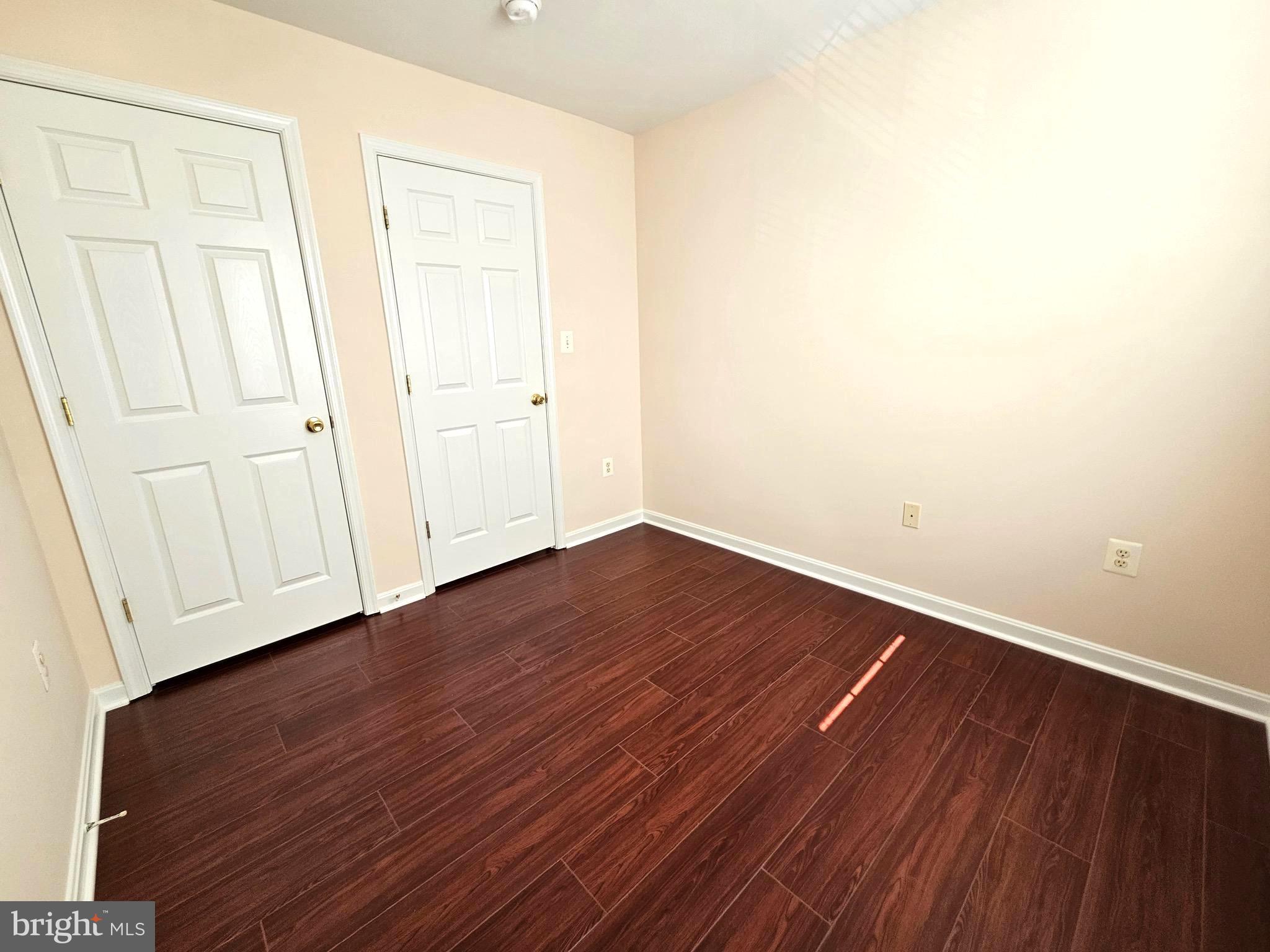 2238 Blue Spruce Drive Culpeper, VA 22701 - Photo 14 of 18 a view of an empty room with wooden floor