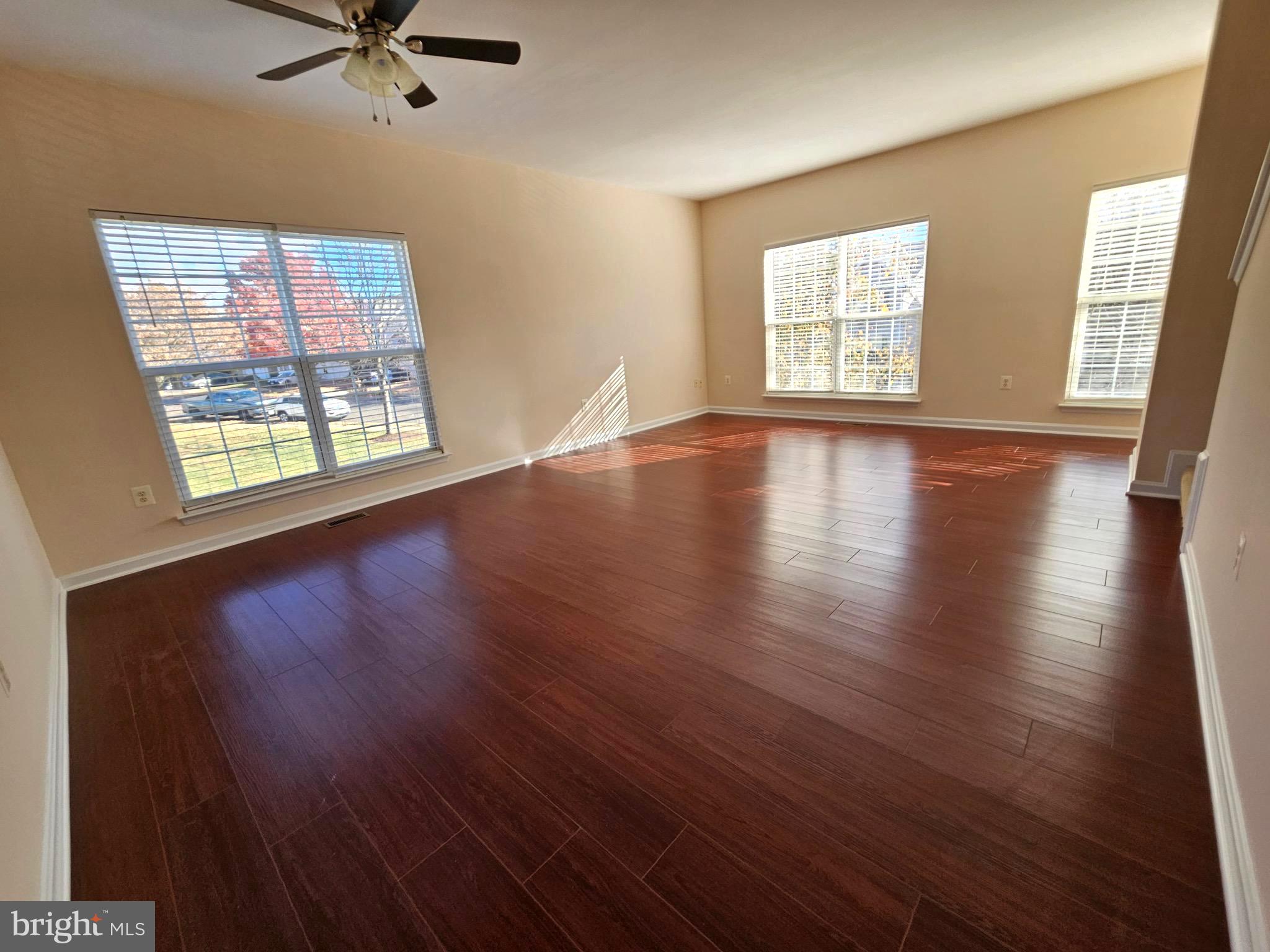 2238 Blue Spruce Drive Culpeper, VA 22701 - Photo 9 of 18 a view of an empty room with wooden floor and a window