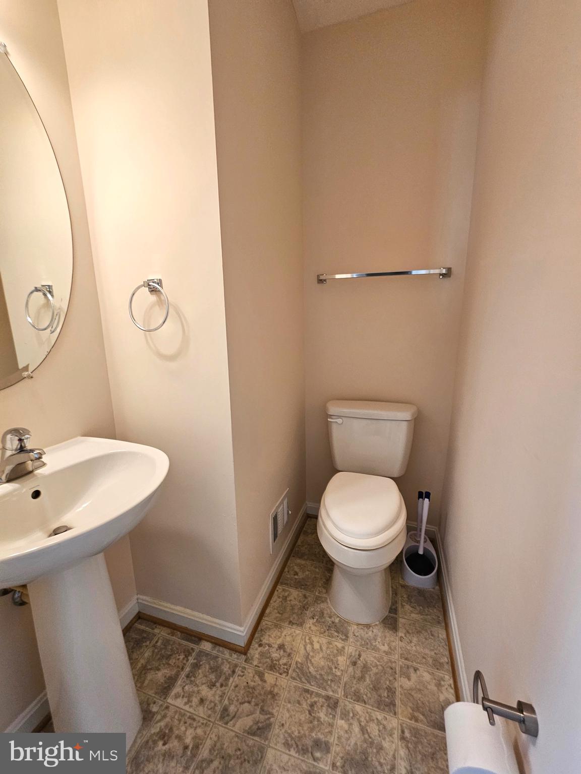 2238 Blue Spruce Drive Culpeper, VA 22701 - Photo 10 of 18 a bathroom with a toilet sink and mirror