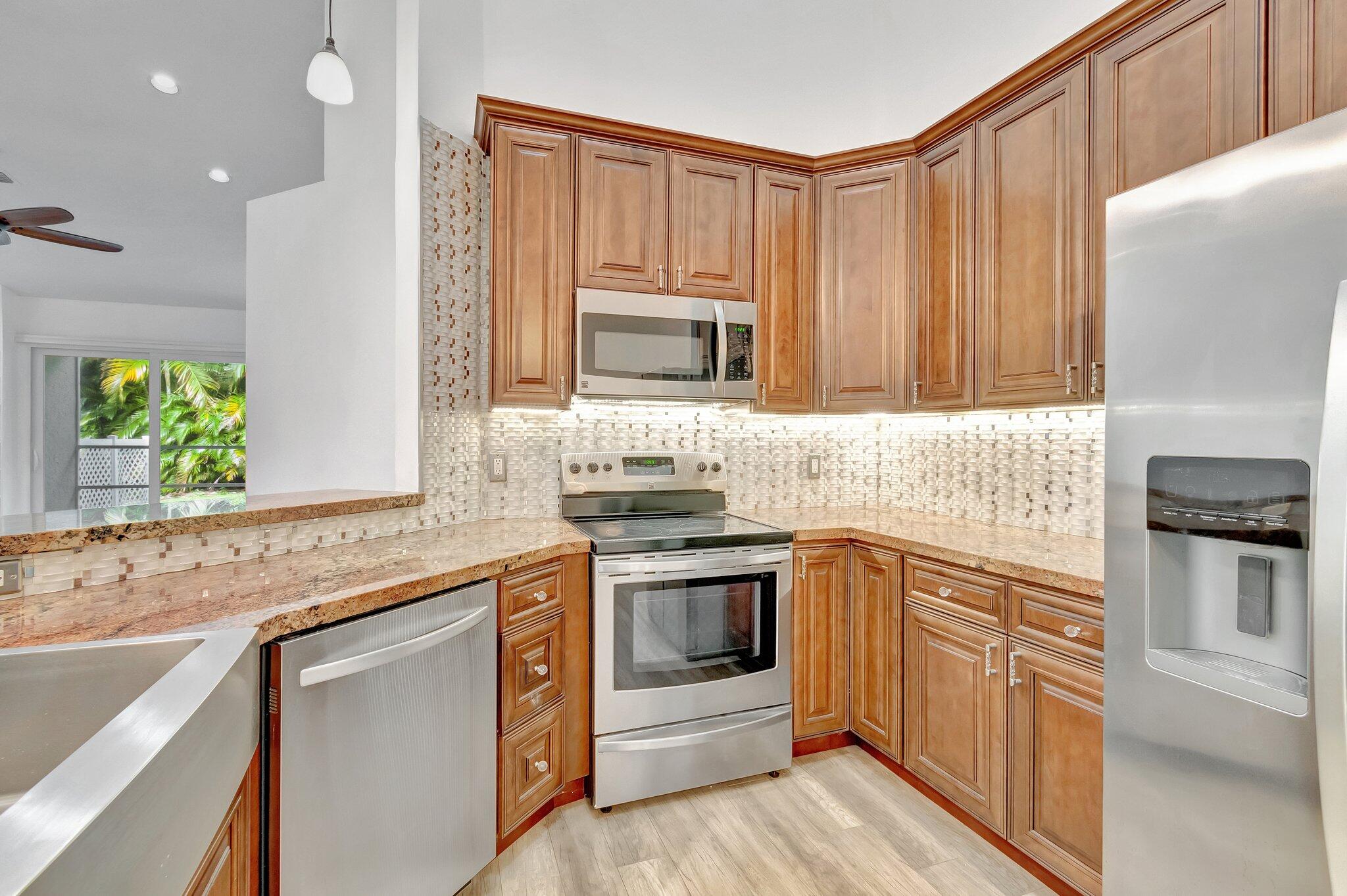 9237 Vineland Court, Unit F Boca Raton, FL 33496 - Photo 11 of 53 WOOD CABINETS