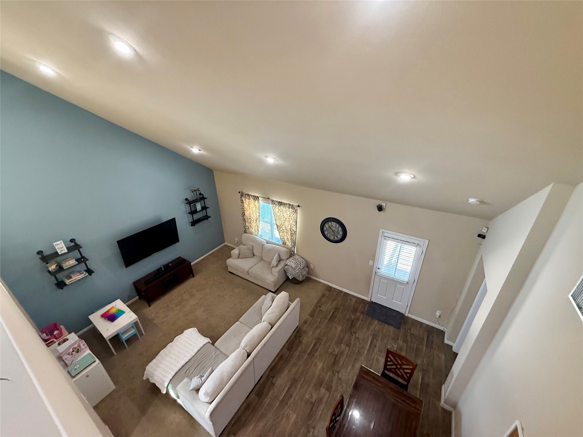 11700 Andesite Road Manor, TX 78653 - Photo 18 of 32 A spacious living area features high ceilings and a welcoming front entrance.