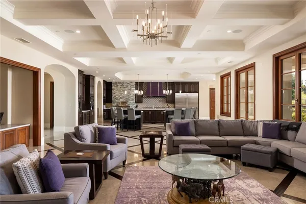 a large kitchen with a table and chairs
