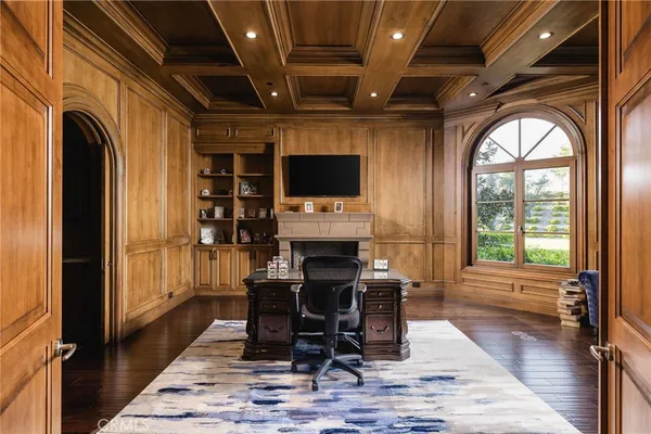 a bedroom with a bed and large window