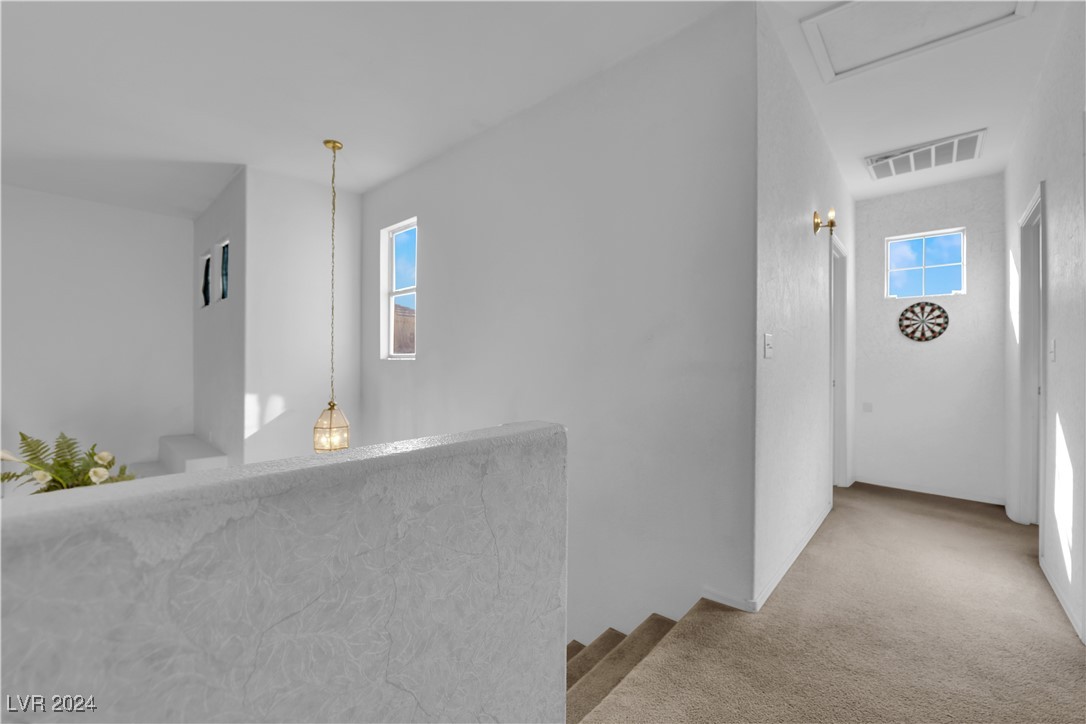 5790 Native Dancer Court Las Vegas, NV 89113 - Photo 14 of 26 Hallway with light colored carpet