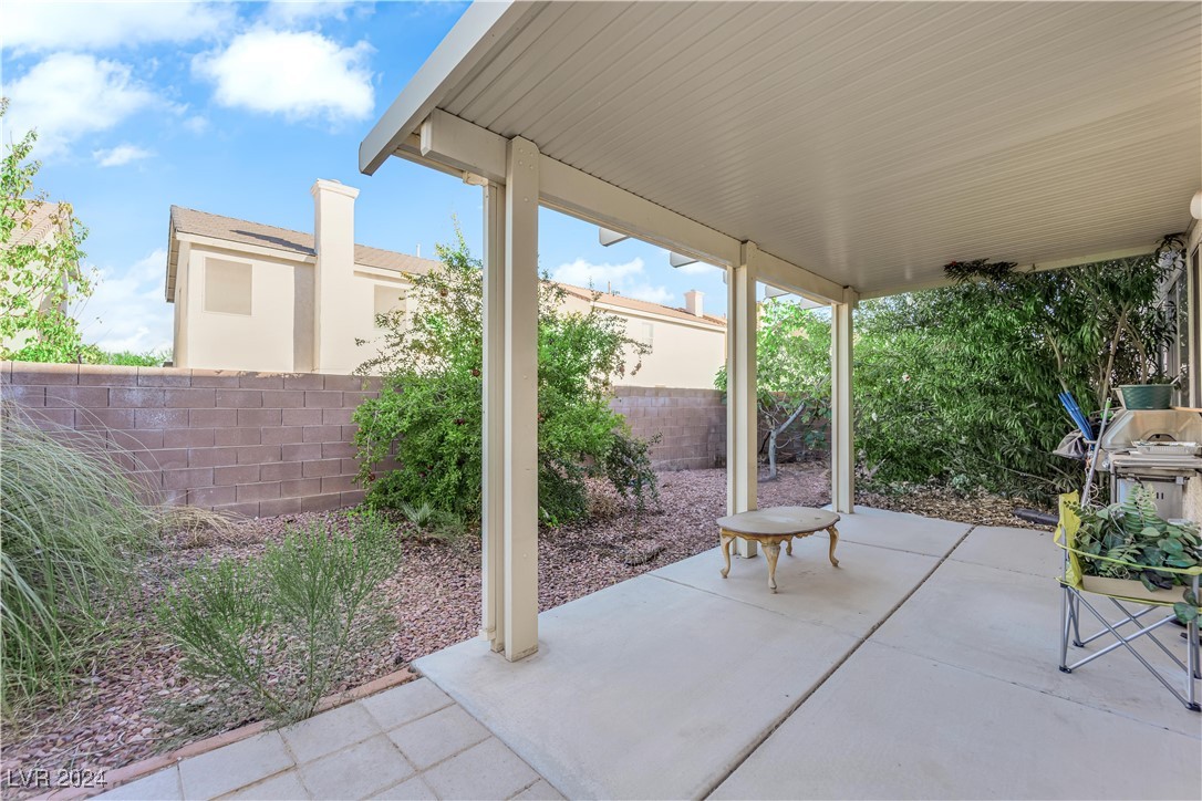 5790 Native Dancer Court Las Vegas, NV 89113 - Photo 25 of 26 Fenced backyard featuring a patio area