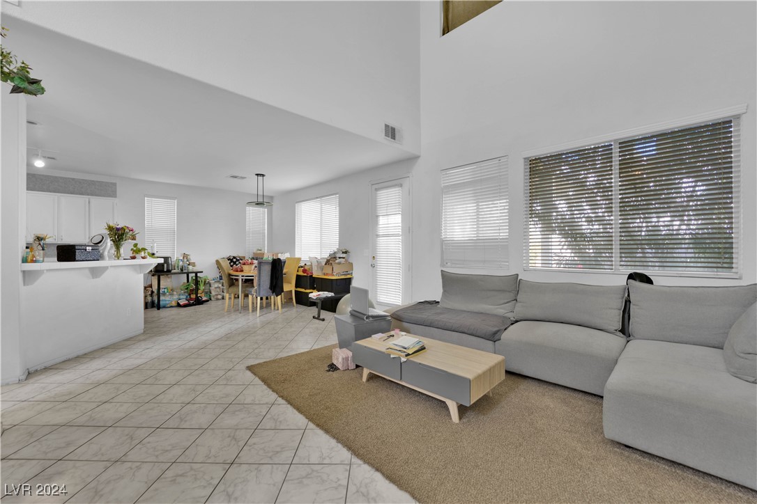 5790 Native Dancer Court Las Vegas, NV 89113 - Photo 4 of 26 Living area featuring a towering ceiling