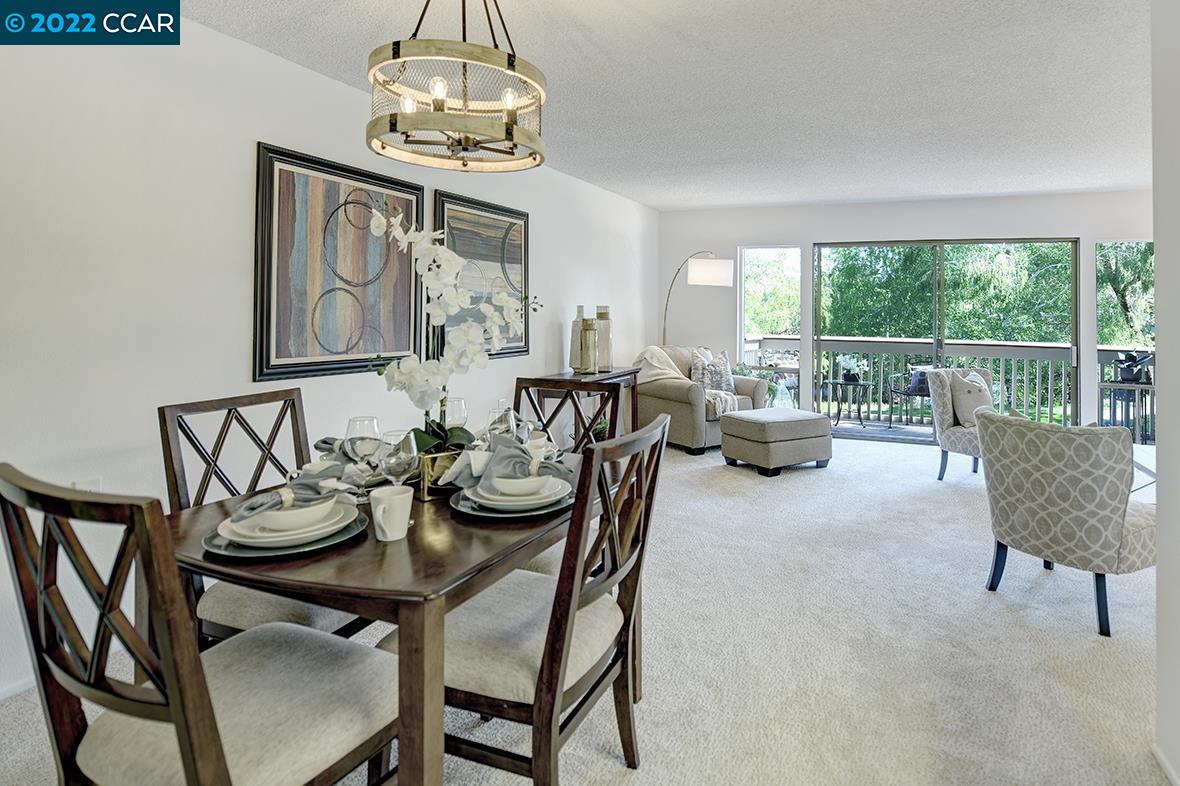 1317 Canyonwood Court, Unit 4 Walnut Creek, CA 94595 - Photo 1 of 1 a view of a dining room with furniture window and outside view