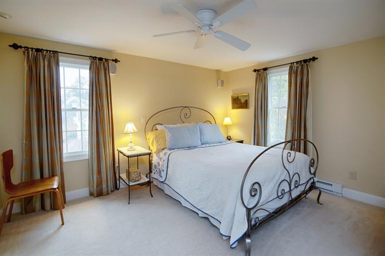 56 Braley Jenkins Road Centerville, MA 02632 - Photo 4 of 14 a bed sitting in a spacious bedroom next to a window