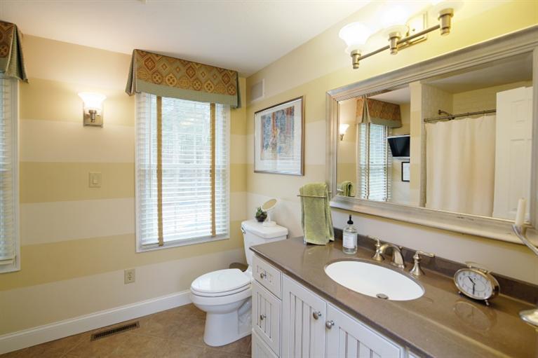 56 Braley Jenkins Road Centerville, MA 02632 - Photo 5 of 14 a bathroom with a granite countertop toilet sink and mirror